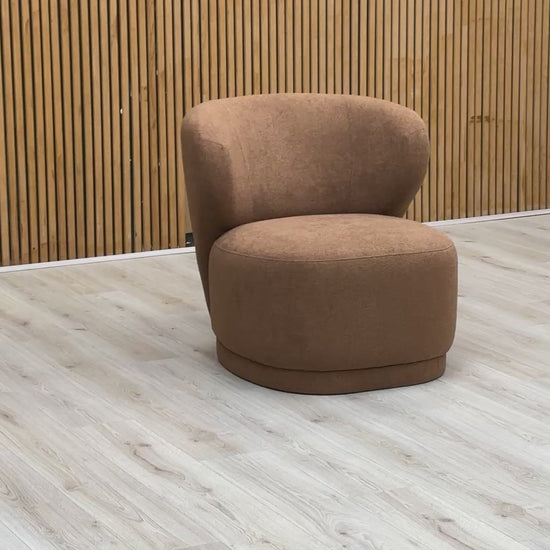 Video demonstration of the Sofology 'Knox' accent chair, showcasing the warm ginger fabric, construction quality, and comfort.