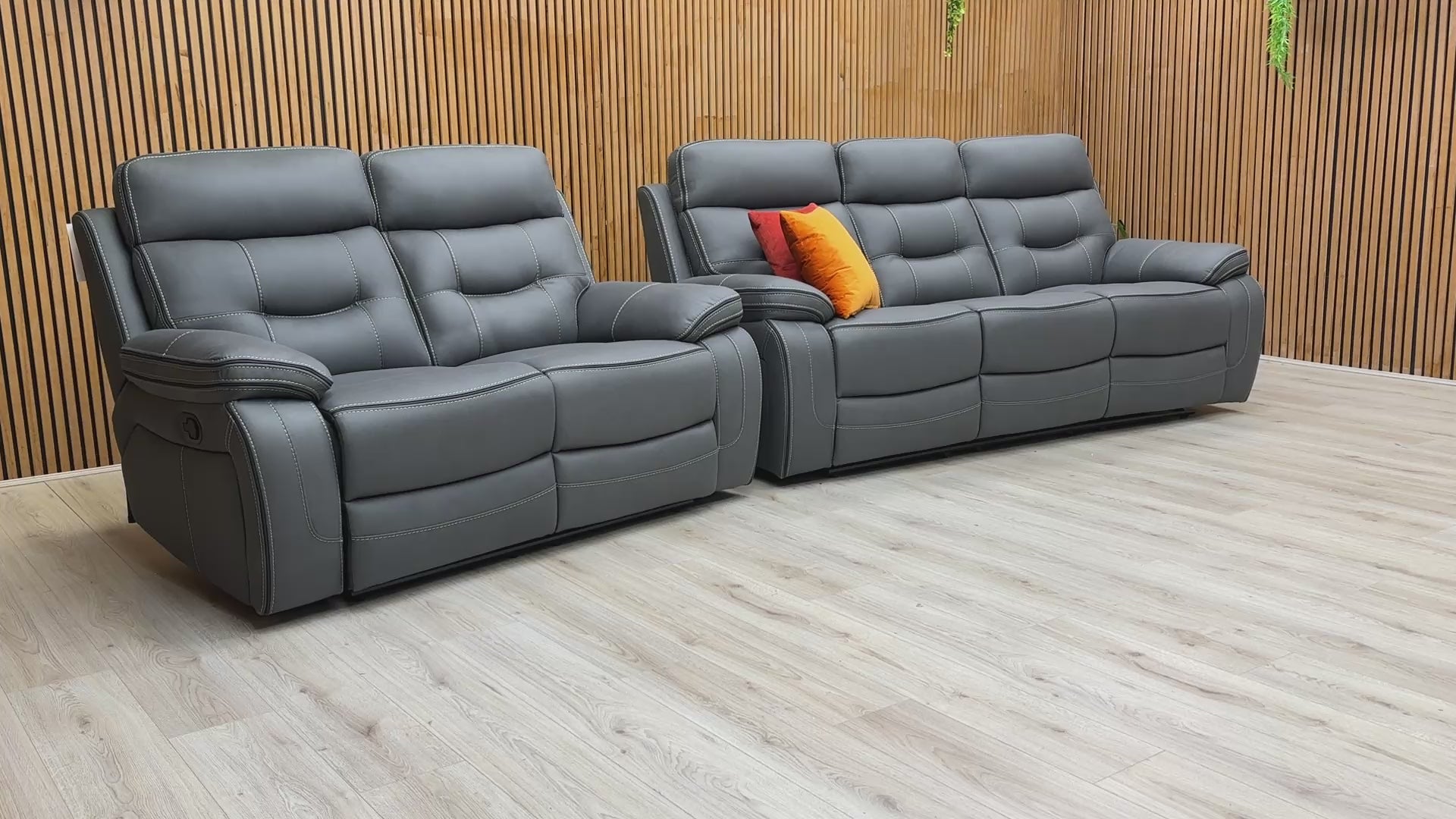Product video tour of the ‘Dante’ Grey Fabric 3+2 Manual Recliner Set, demonstrating the smooth reclining action and the generous seating space of both sofas.