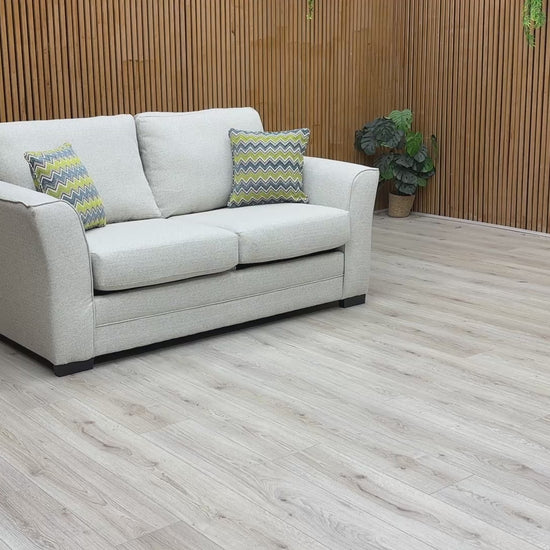 Product video play button featuring the Albany sofa bed, illustrating the smooth conversion from sofa to bed and the quality of the woven fabric.