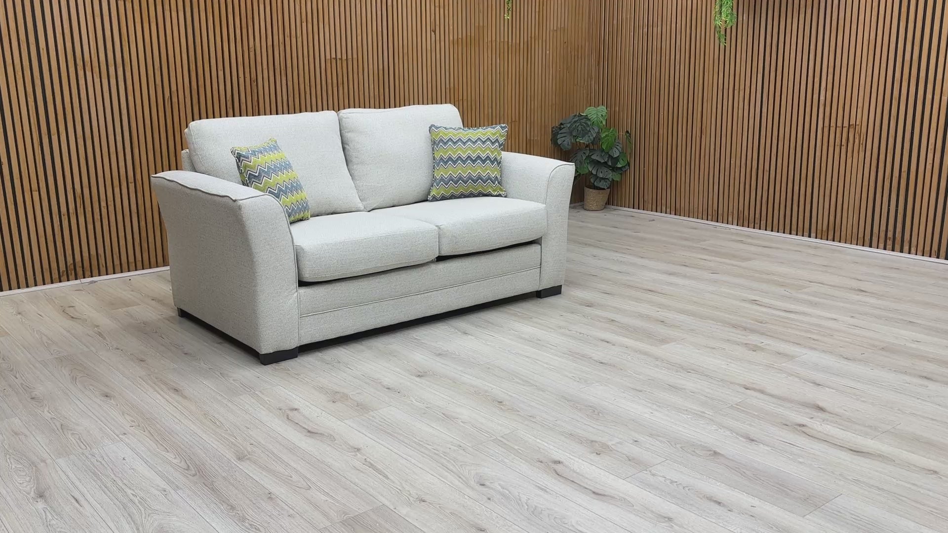 Product video play button featuring the Albany sofa bed, illustrating the smooth conversion from sofa to bed and the quality of the woven fabric.