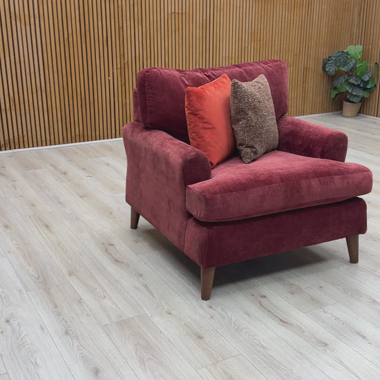 Product video tour of the ‘Jackson’ Paprika Red Fabric Armchair, demonstrating the fabric texture, the supportive depth of the seat cushion, and the overall premium build quality.