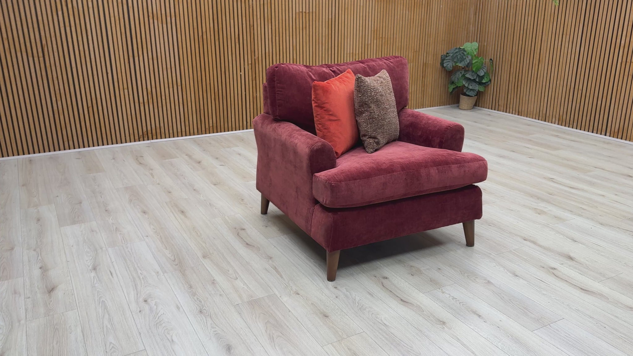 Product video tour of the ‘Jackson’ Paprika Red Fabric Armchair, demonstrating the fabric texture, the supportive depth of the seat cushion, and the overall premium build quality.