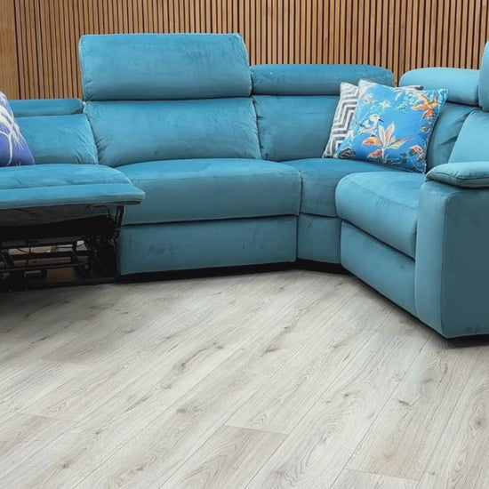 Video Of ‘Nicoletti Davide’ Italian designer small corner sectional sofa, beautifully upholstered in high-grade Teal fabric, featuring integrated independent electronic power recliners.