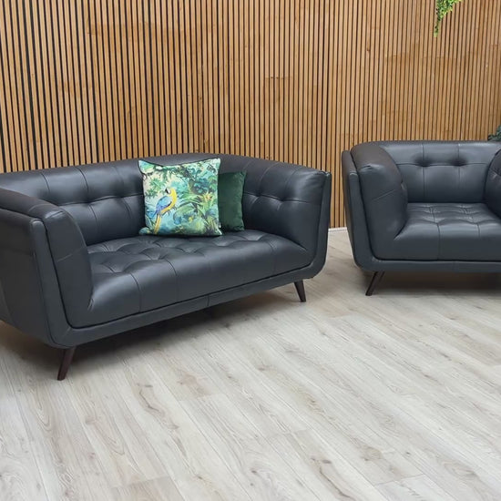 Video preview demonstrating the luxurious features and detailing of the 'Rene' Navy Blue Leather Sofa and Armchair set.