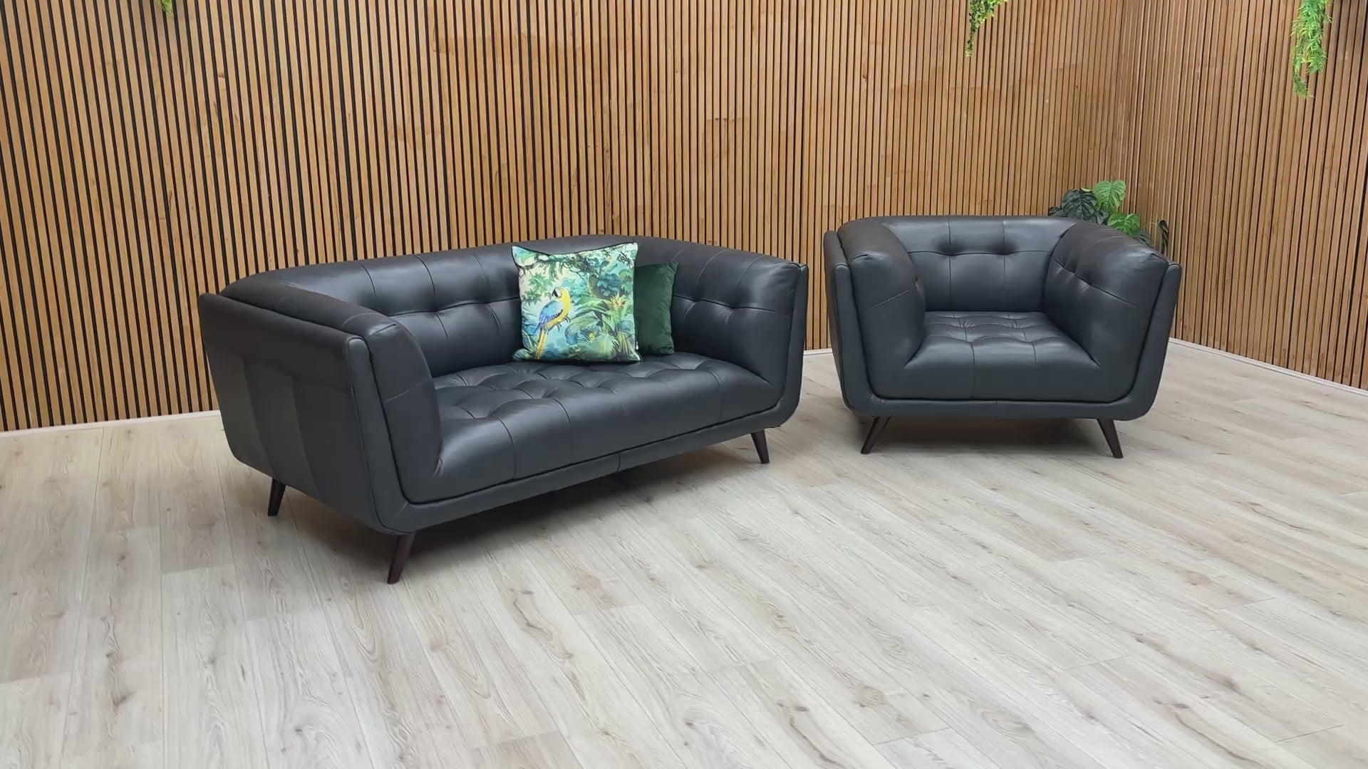 Video preview demonstrating the luxurious features and detailing of the 'Rene' Navy Blue Leather Sofa and Armchair set.