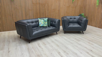 Video preview demonstrating the luxurious features and detailing of the 'Rene' Navy Blue Leather Sofa and Armchair set.