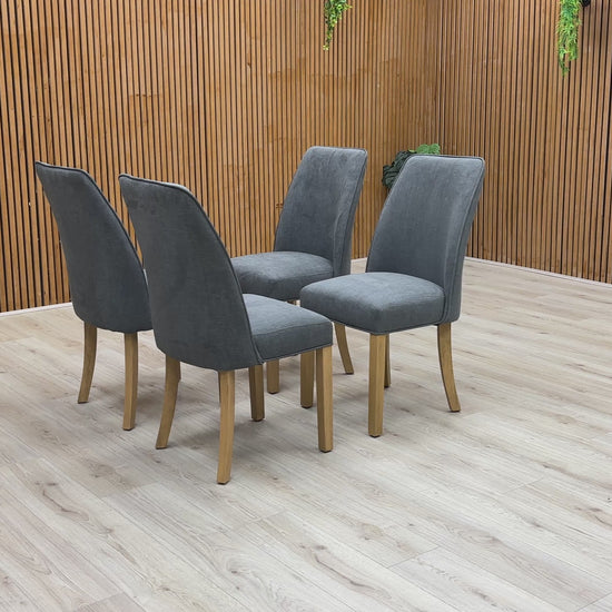 Video of demonstration of the Furnitureland 'Hamilton' Charcoal Grey Fabric Dining Chair, showing its features, size, or placement.