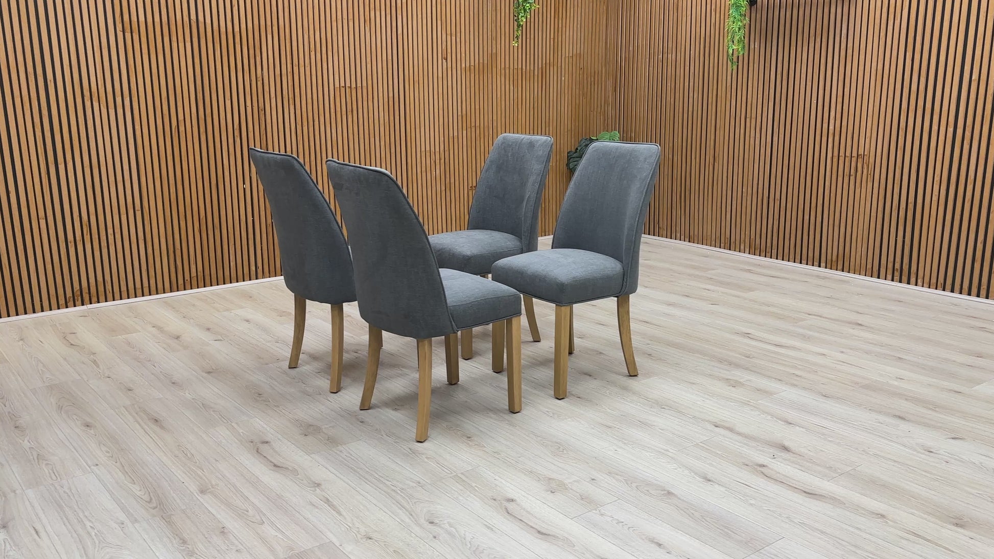 Video of demonstration of the Furnitureland 'Hamilton' Charcoal Grey Fabric Dining Chair, showing its features, size, or placement.