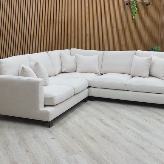 Product video tour of the Lugano sofa, showcasing the fabric texture, seating depth, and metal feet.