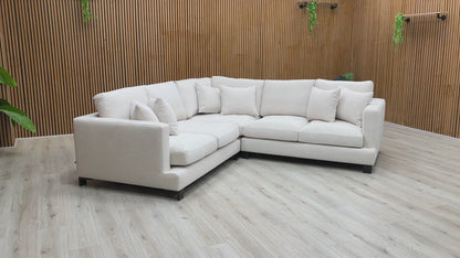 Product video tour of the Lugano sofa, showcasing the fabric texture, seating depth, and metal feet.