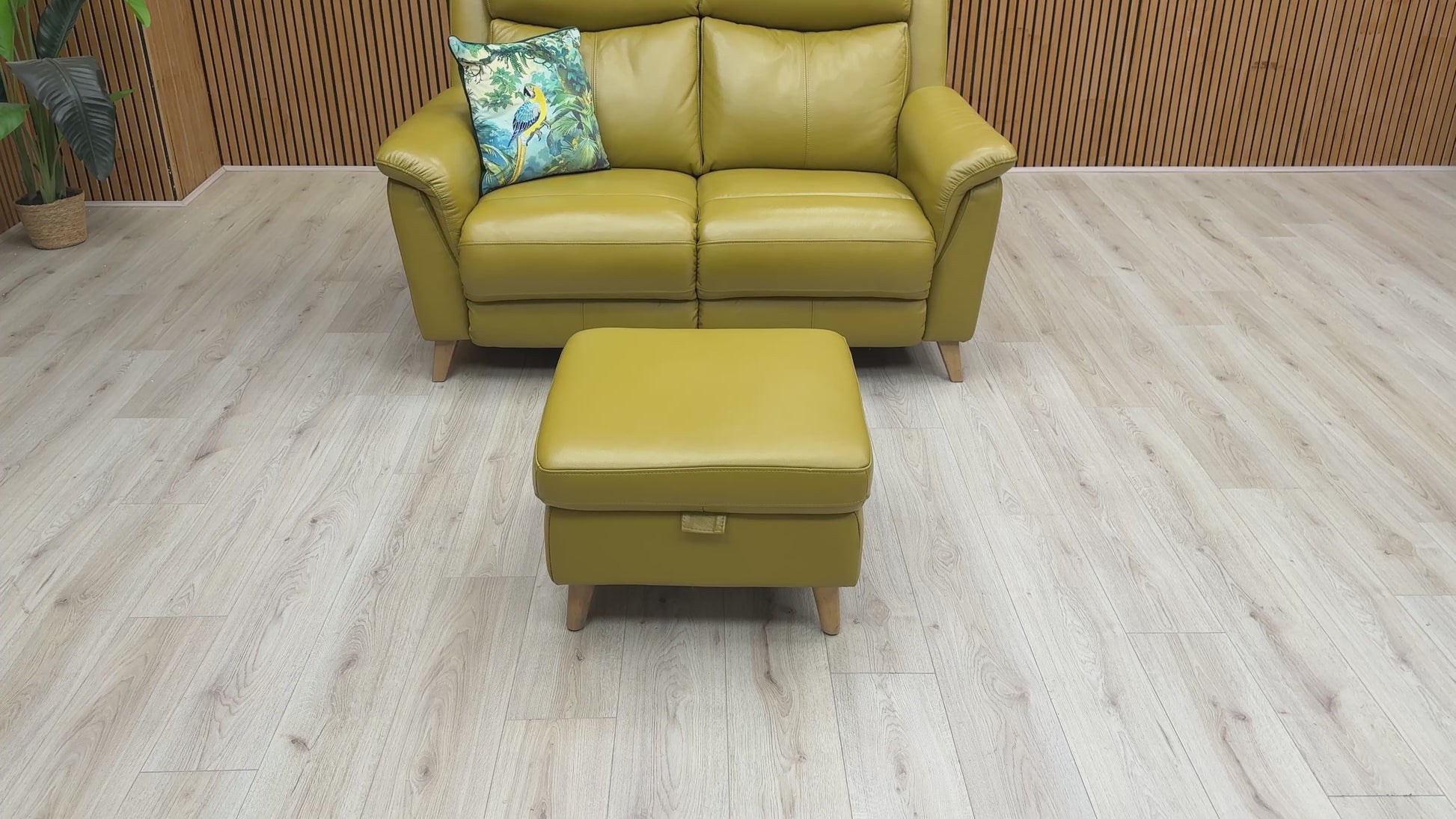 Video preview image for the product, demonstrating the size, leather finish, and features, including the storage footstool.