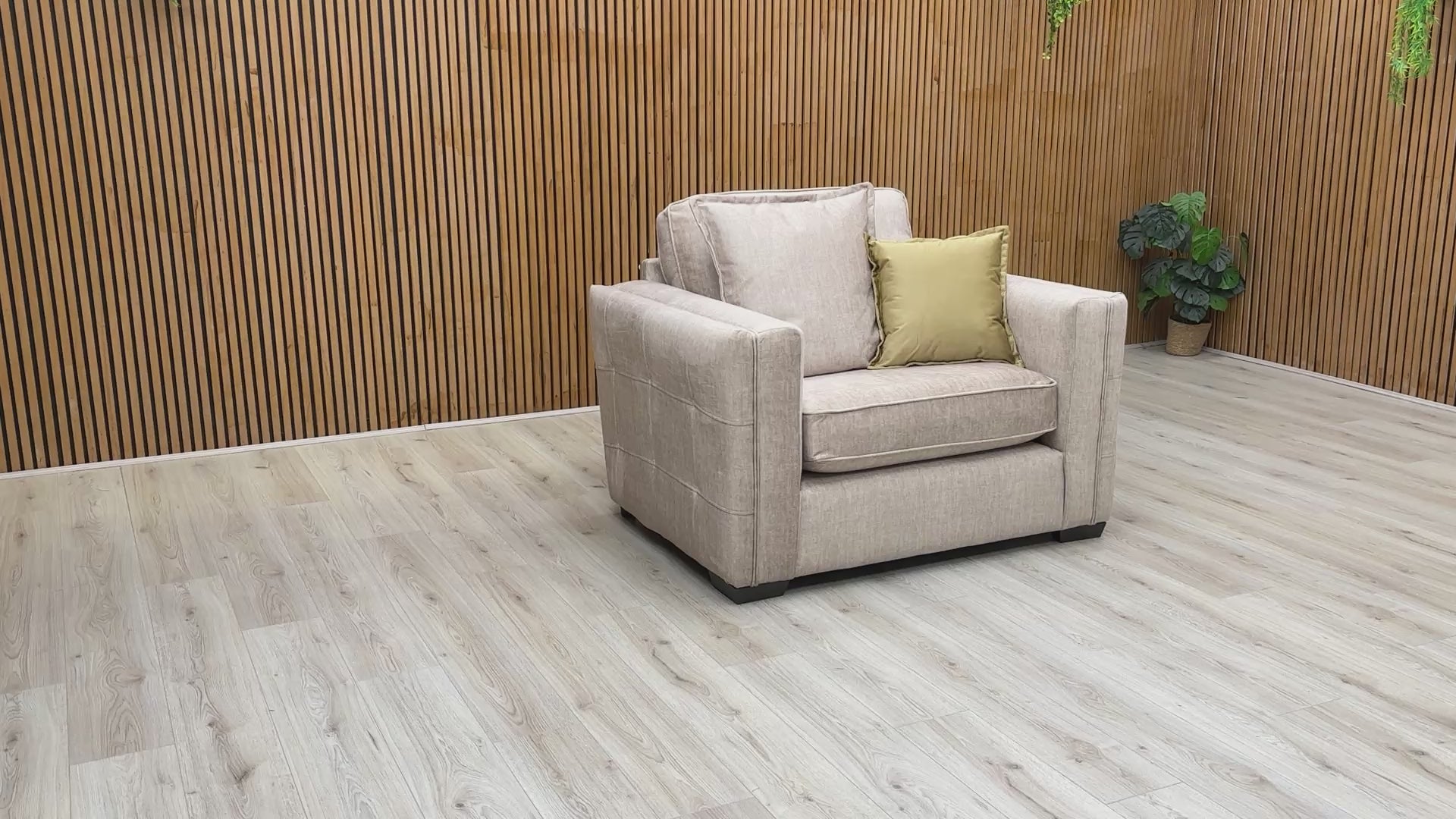 Video showcase of the Chelsea snuggler chair, detailing the soft texture of the Vogue velvet and the supportive foam-filled formal back cushions.