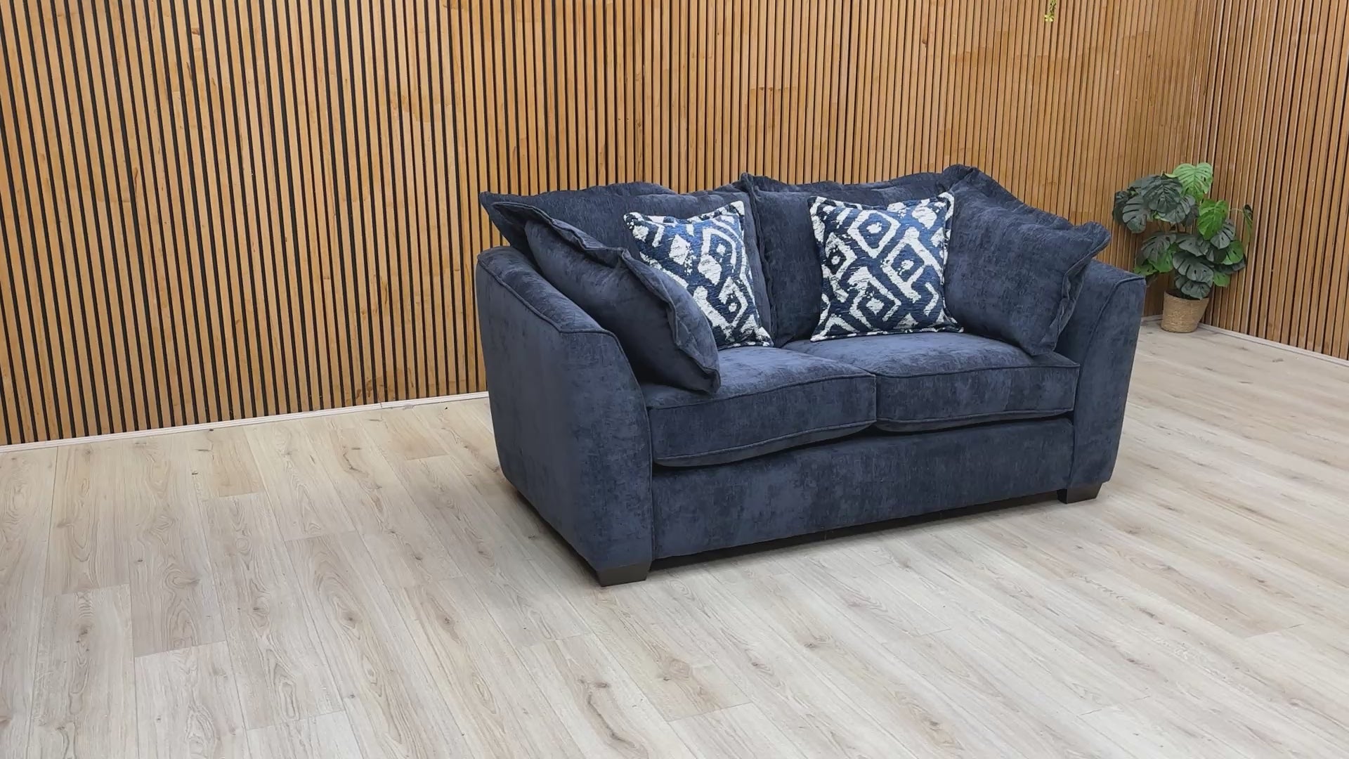 Product video tour of the ‘Finchley’ Denim Blue Soft Weave 2 Seater Sofa, demonstrating the fabric’s tactile quality, cushion recovery, and solid build.