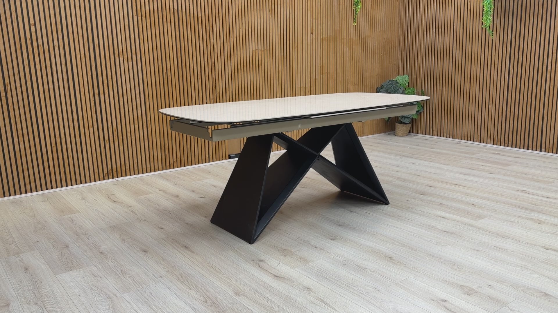 Video demonstration showing the smooth pop-up extension mechanism of the Oasis table, extending from 180cm to 240cm.