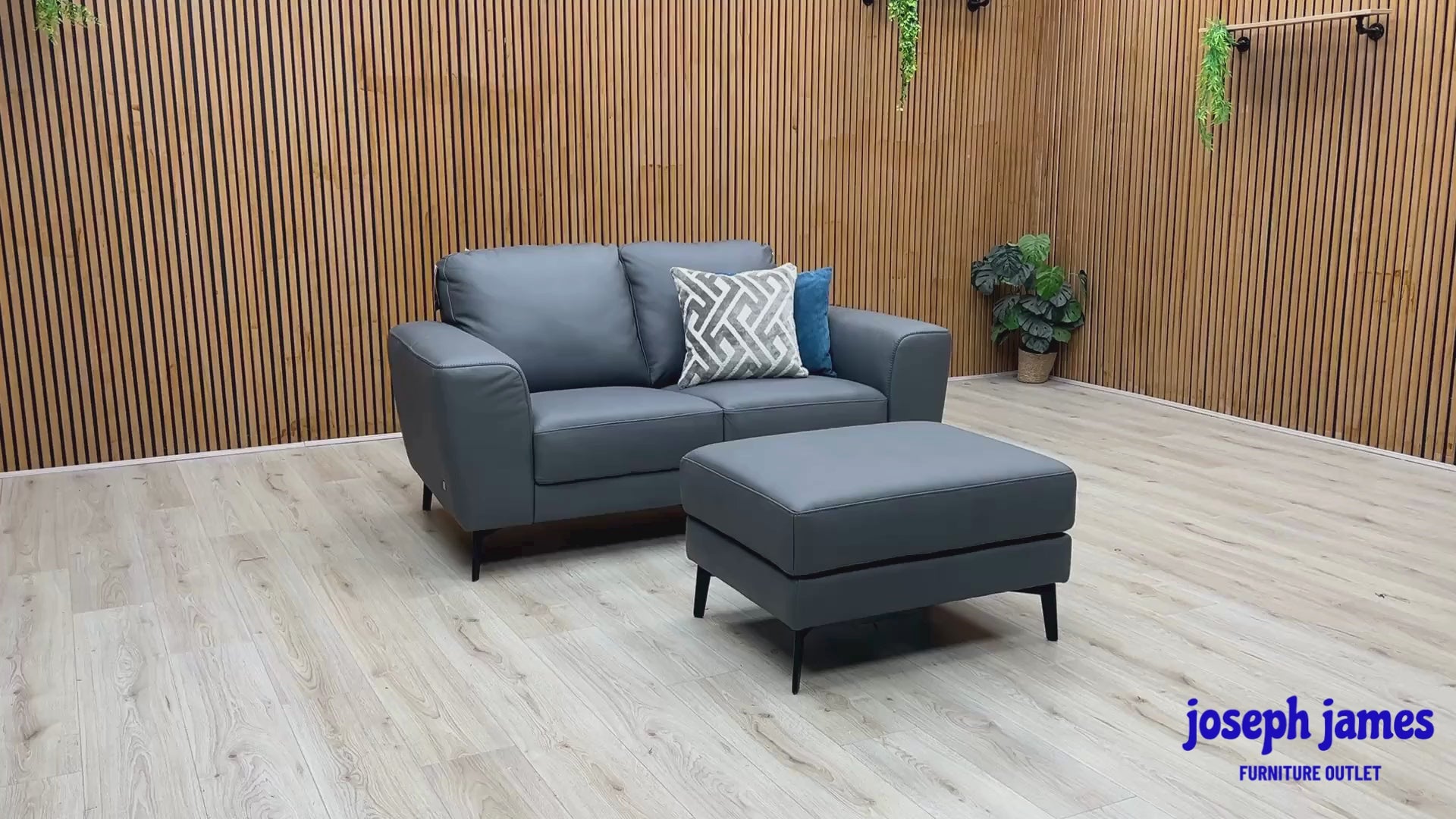 Video Of ‘Bocelli’ contemporary living room suite, showcasing a luxury 2-seater sofa and matching independent footstool beautifully upholstered in Tatto Grey 4370 premium leather.