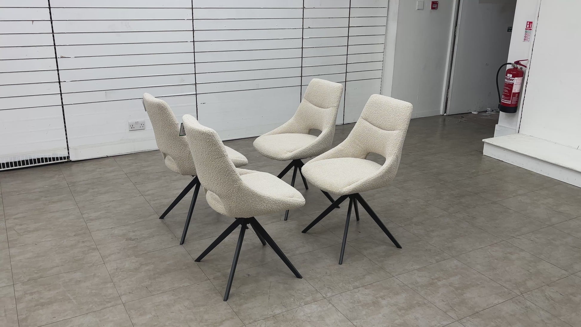 Video of the smooth 360-degree swivel base functionality on the cream boucle dining chair.