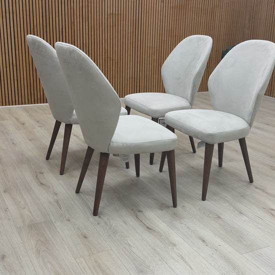 Product walkthrough highlighting the water-repellent fabric treatment and high-back ergonomic support of the Empire dining chair.