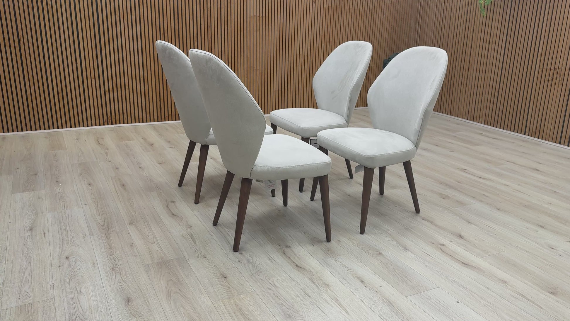 Product walkthrough highlighting the water-repellent fabric treatment and high-back ergonomic support of the Empire dining chair.