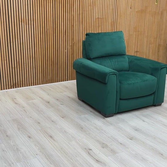 Product video tour of the ‘Nixon’ Emerald Green Velvet Armchair, demonstrating the soft fabric texture, seat comfort, and high-quality construction.