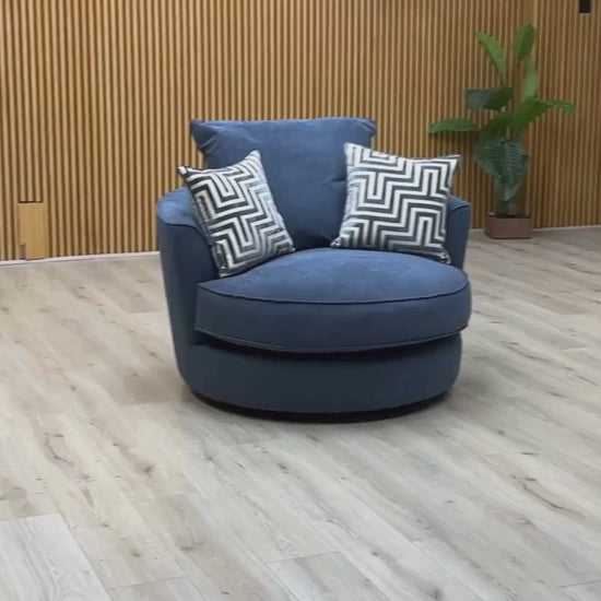 Video of ‘Legend’ contemporary classic-back swivel armchair, beautifully upholstered in high-grade Cosmo Navy Blue fabric, featuring a deep, inviting tub-style silhouette and a hidden rotational base.