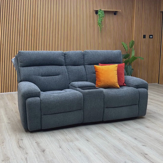 Video Of ‘Cinemax’ contemporary 2-seater home cinema power recliner sofa, beautifully upholstered in high-grade Charcoal Grey fabric with an integrated central media console and electronic power headrests.