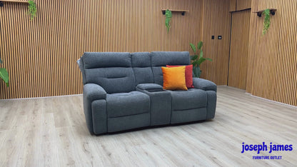Video Of ‘Cinemax’ contemporary 2-seater home cinema power recliner sofa, beautifully upholstered in high-grade Charcoal Grey fabric with an integrated central media console and electronic power headrests.
