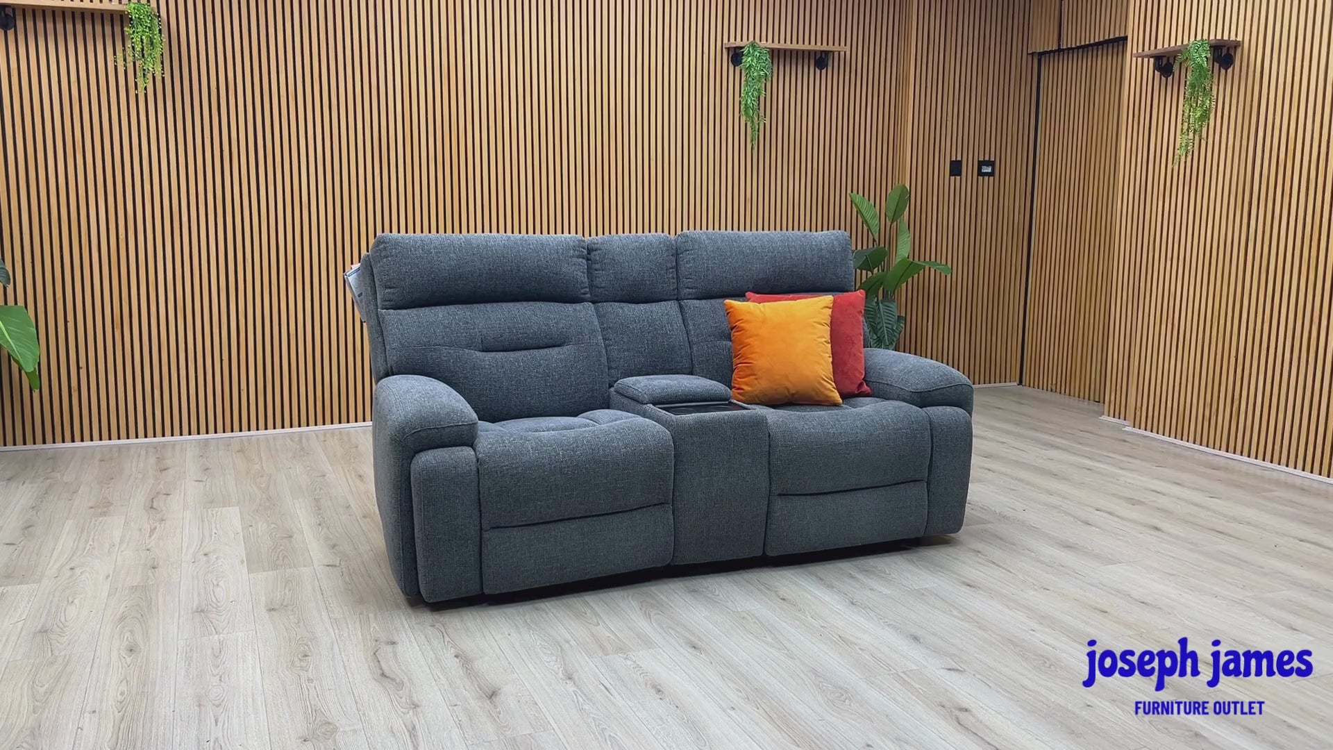 Video Of ‘Cinemax’ contemporary 2-seater home cinema power recliner sofa, beautifully upholstered in high-grade Charcoal Grey fabric with an integrated central media console and electronic power headrests.