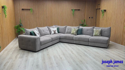 Video Of ‘Goliath’ contemporary XL open end corner sofa, beautifully upholstered in high-grade Manhattan Nutmeg 58005 fabric featuring an integrated functional storage armrest.