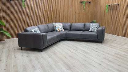 Product tour of the Brody Grey Italian Leather Corner Sofa, demonstrating the leather's quality, seat bounce, and the solid build of the frame.