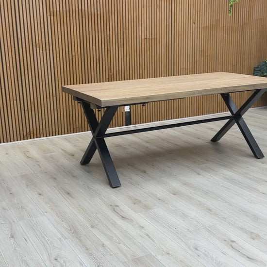 Video preview of the Saturn Solid Oak Dining Table on a black X-shaped base.