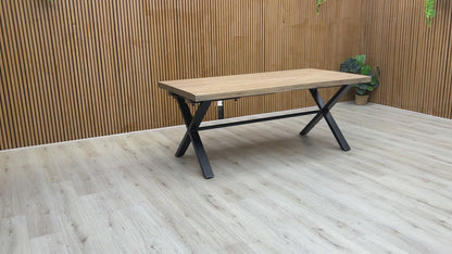 Video preview of the Saturn Solid Oak Dining Table on a black X-shaped base.