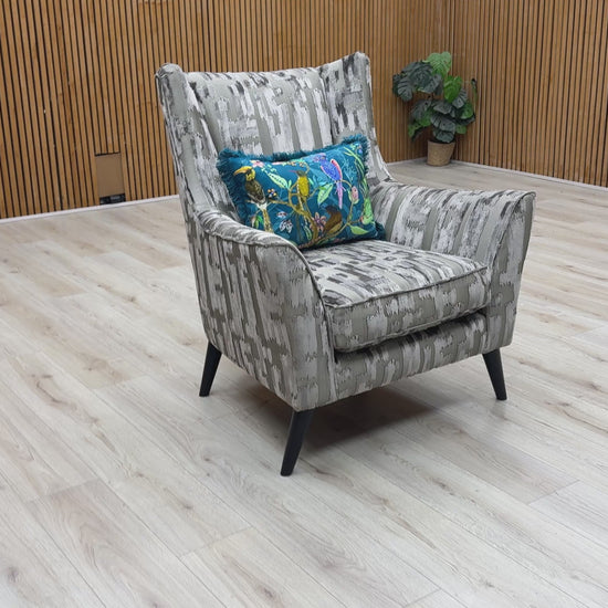 Product video tour of the Boutique ‘Allure’ Iron Patterned Fabric Wing Chair, demonstrating the texture of the weave, the supportive back, and the premium UK-handmade craftsmanship.