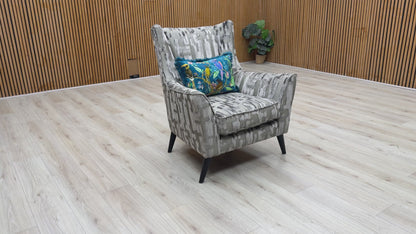 Product video tour of the Boutique ‘Allure’ Iron Patterned Fabric Wing Chair, demonstrating the texture of the weave, the supportive back, and the premium UK-handmade craftsmanship.