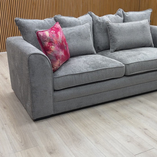 Product video tour of the Soho scatter back sofa, demonstrating the fabric texture and plush comfort of the cushions.