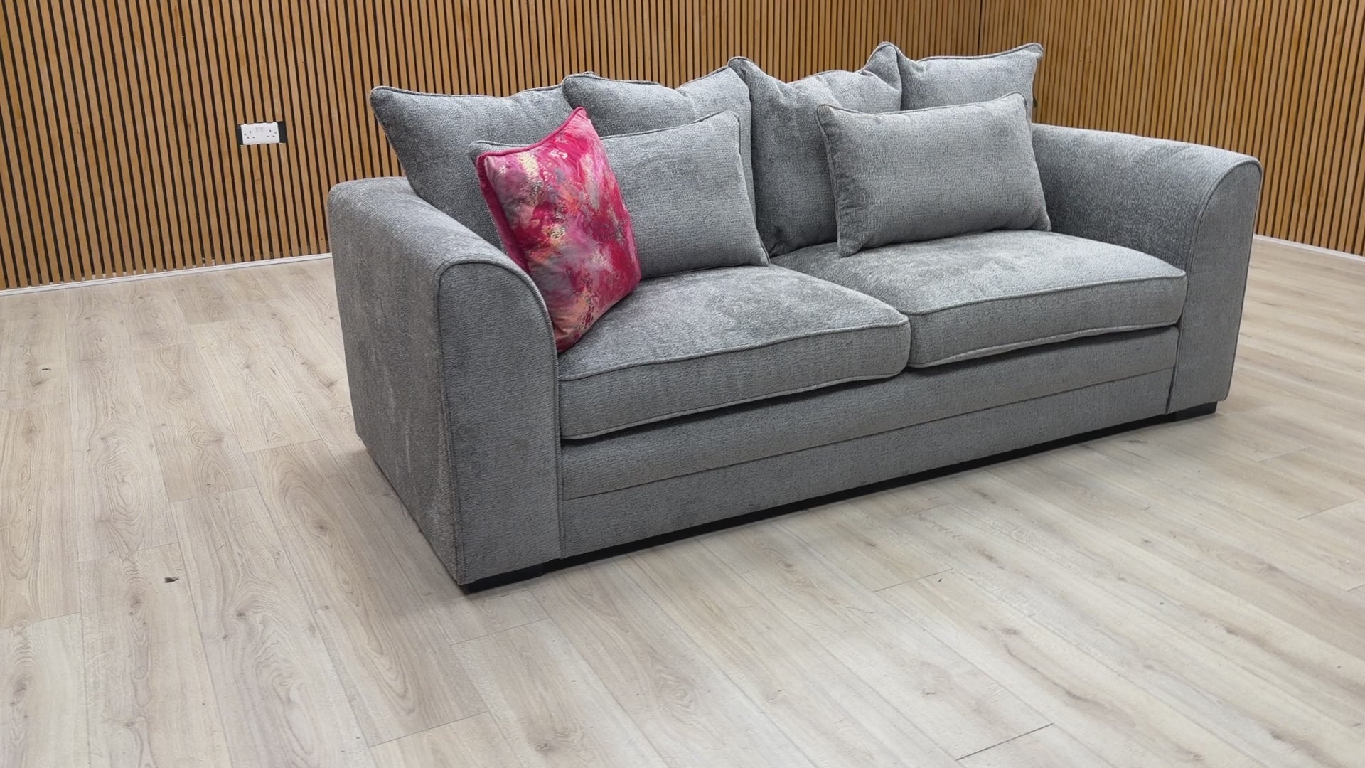 Product video tour of the Soho scatter back sofa, demonstrating the fabric texture and plush comfort of the cushions.