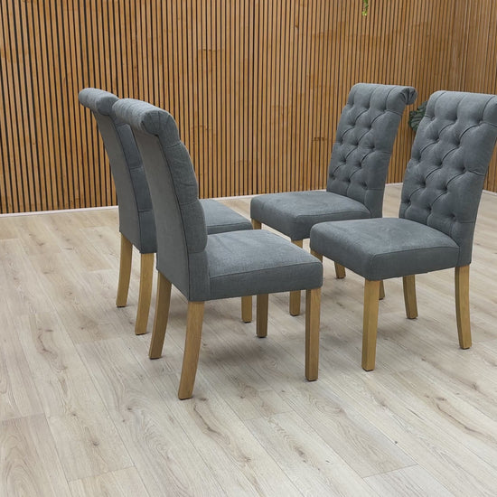 Video showcase of the Hamilton dining chair set, highlighting the fabric texture, roll back elegance, and sturdy leg construction.