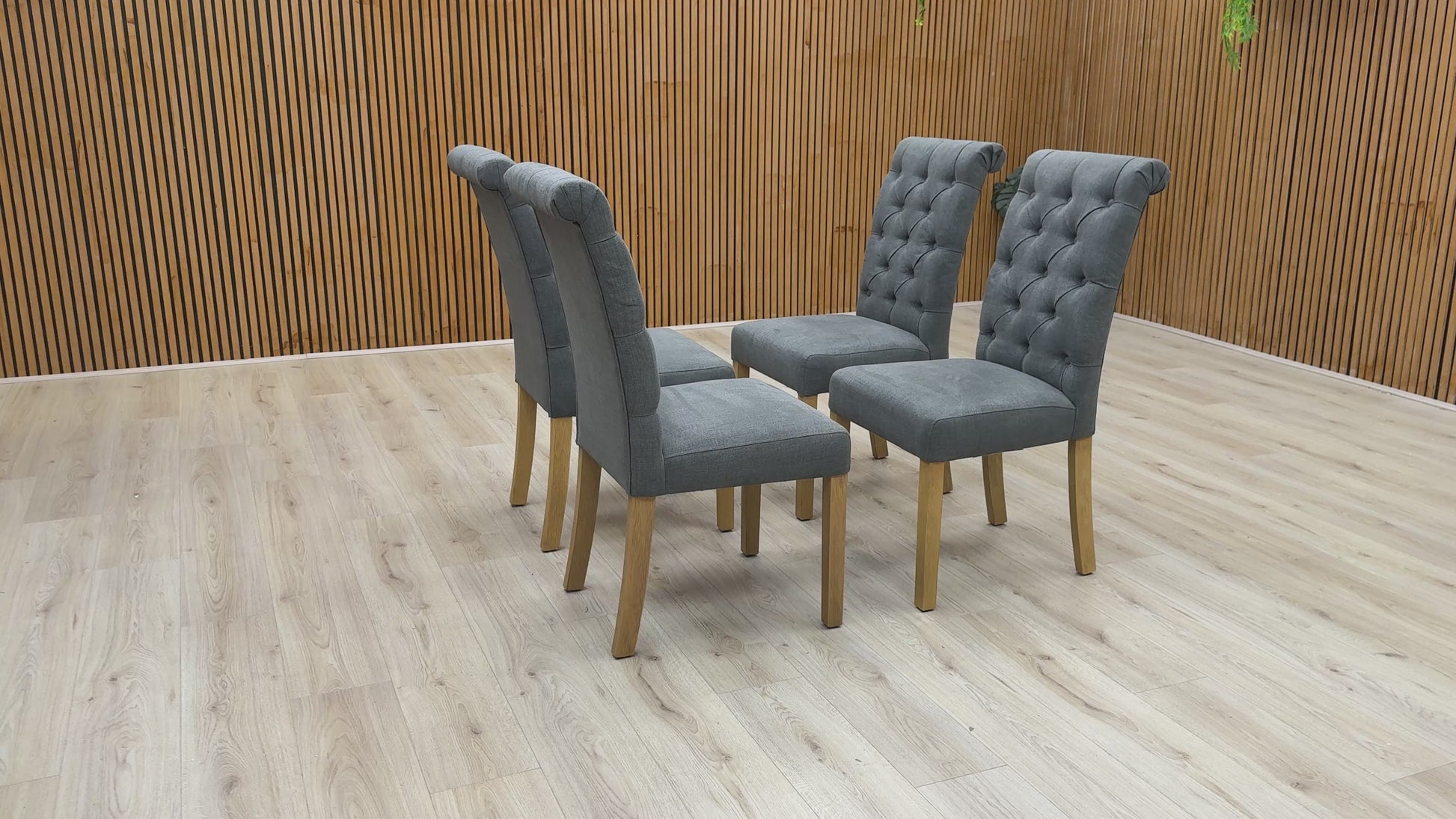 Video showcase of the Hamilton dining chair set, highlighting the fabric texture, roll back elegance, and sturdy leg construction.