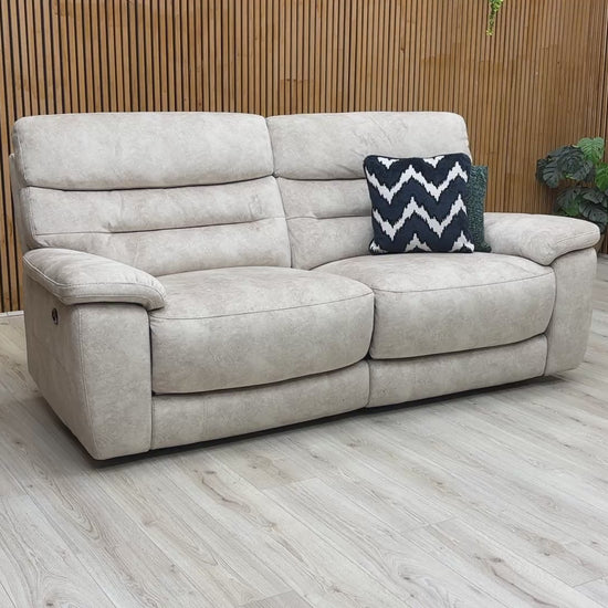 Product video demonstration of the ‘Nimbus’ Cream Velvet 3 Seater Power Recliner Sofa, highlighting the reclining mechanism and integrated USB charging port.