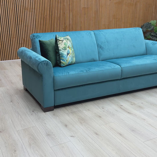 Product video tour of the Nicoletti ‘Alcova’ Teal Velvet 3-Seater Sofa, demonstrating the fabric’s premium texture, the supportive seat depth, and the exceptional Italian craftsmanship.
