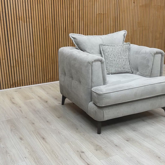 Product video tour of the ‘Farrah’ Riga Silver Fabric Classic Back Chair, demonstrating the fabric’s tactile texture, seat rebound, and compact build quality.