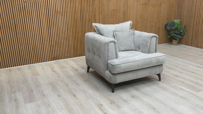 Product video tour of the ‘Farrah’ Riga Silver Fabric Classic Back Chair, demonstrating the fabric’s tactile texture, seat rebound, and compact build quality.