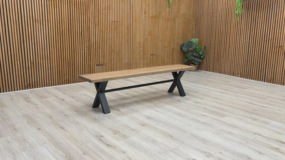 Product walkthrough video demonstrating the Saturn 180cm bench, showcasing the tactile texture of the solid wood grain, the sturdy non-wobble frame construction, and its real-world scale.