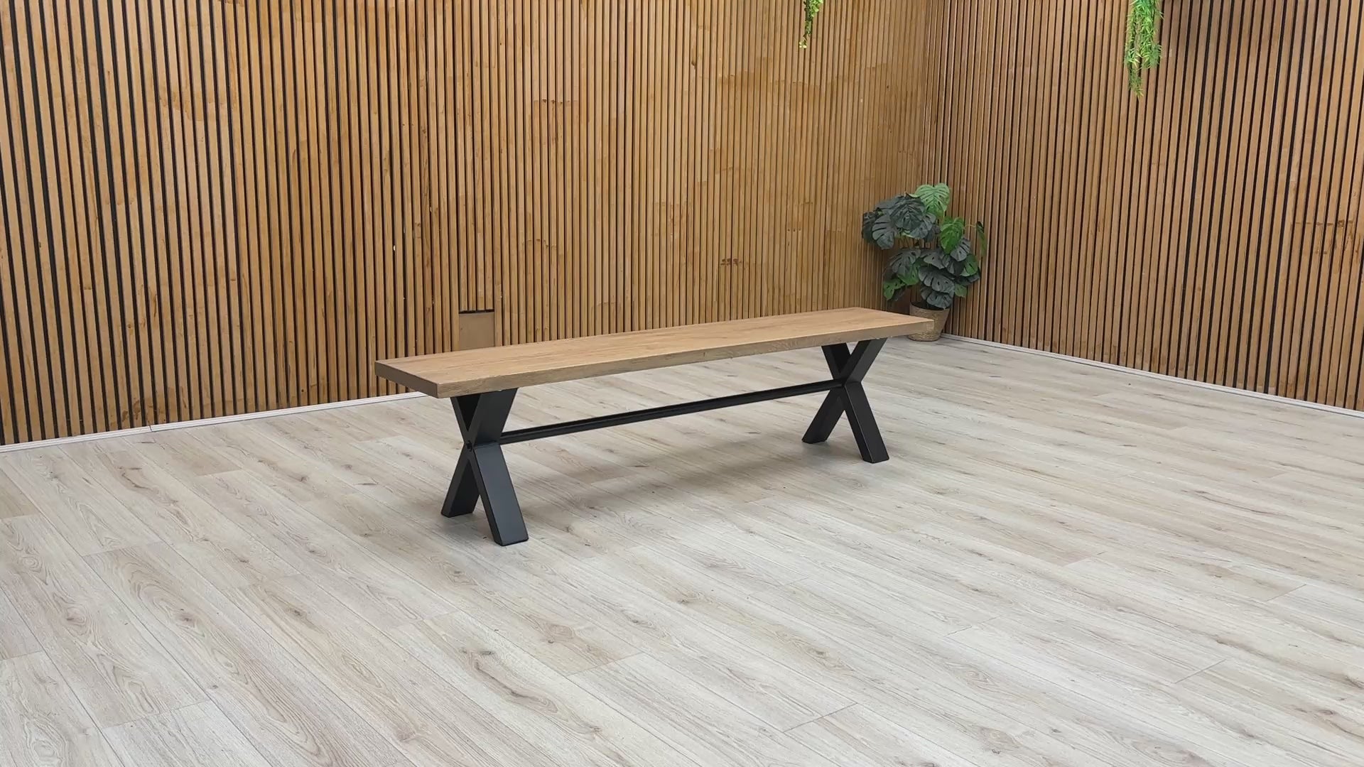 Product walkthrough video demonstrating the Saturn 180cm bench, showcasing the tactile texture of the solid wood grain, the sturdy non-wobble frame construction, and its real-world scale.