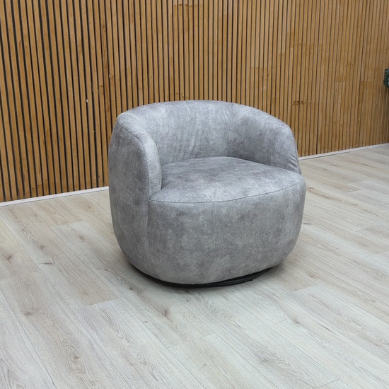 Video demonstration of the ‘Terry’ accent chair, showcasing the smooth 360-degree swivel mechanism and the tactile quality of the silver velvet fabric.