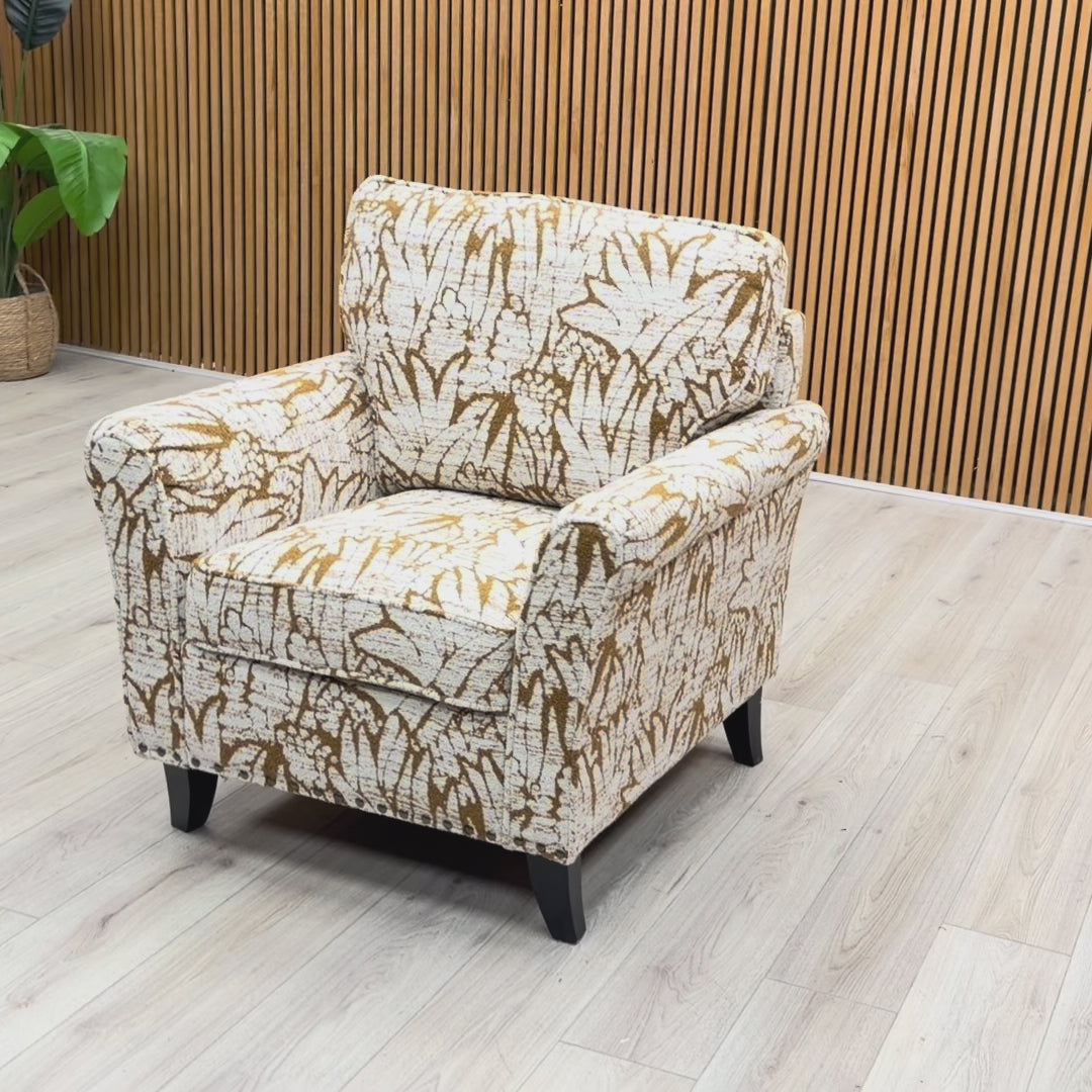 Product video tour of the ‘Pippa’ Mustard Floral Fabric Armchair, showing the fabric texture and design from various angles.