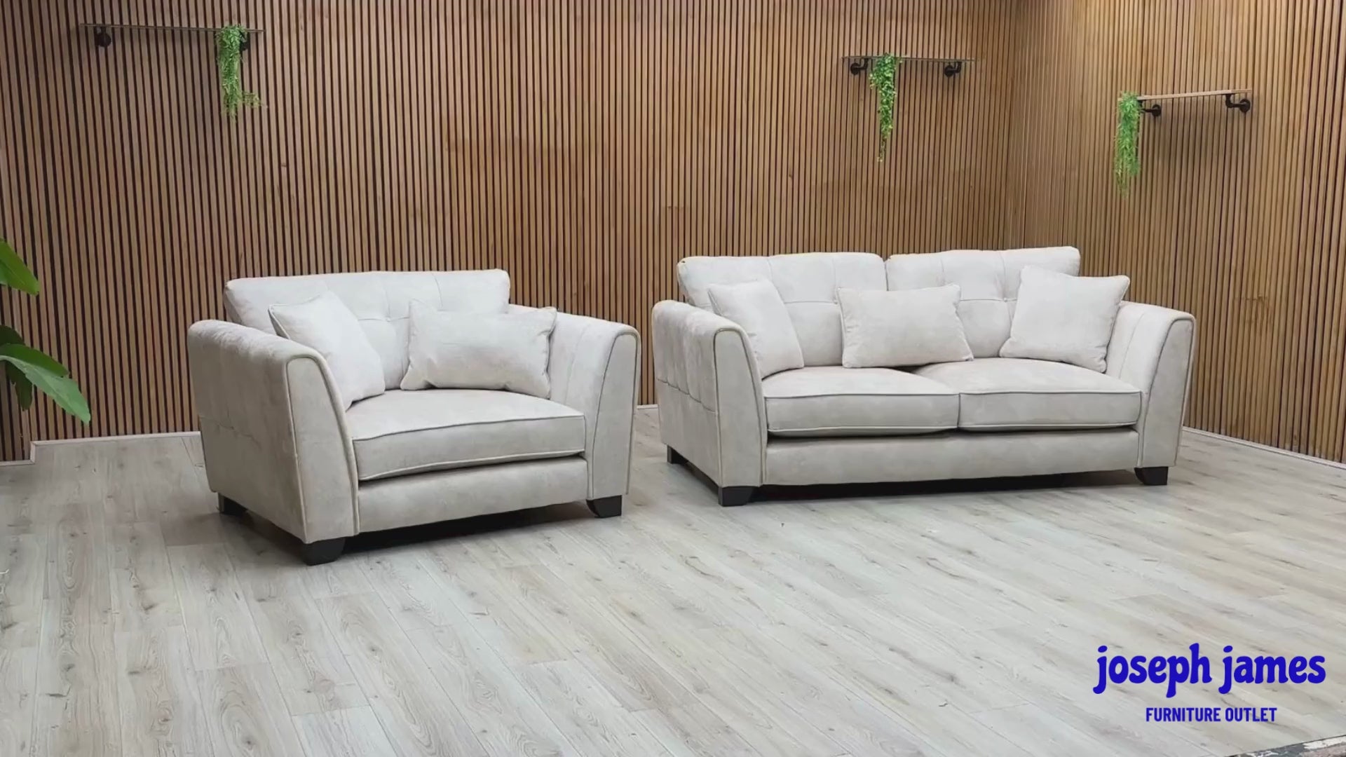 Video Of ‘Mariah’ contemporary living room furniture set, featuring a 3-seater classic back sofa and matching snuggler chair, beautifully upholstered in luxurious Dapple Ivory fabric with elegant brushed brass structural trim inserts.