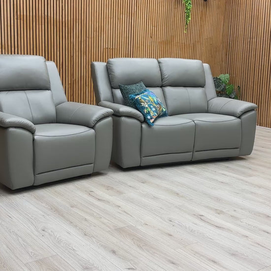 Product video play button for the Utah power recliner set, demonstrating the advanced comfort features including power headrests, lumbar support, and heated seating.
