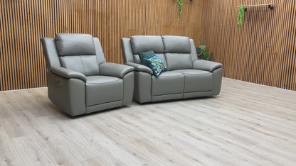 Product video play button for the Utah power recliner set, demonstrating the advanced comfort features including power headrests, lumbar support, and heated seating.