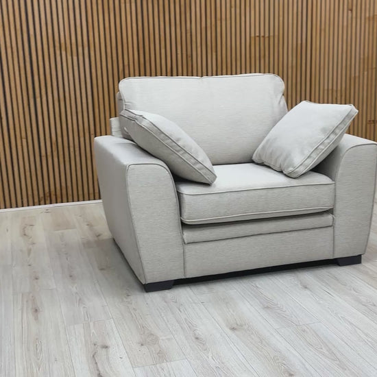video showcasing the 'Chalfont' armchair in a modern living room environment.