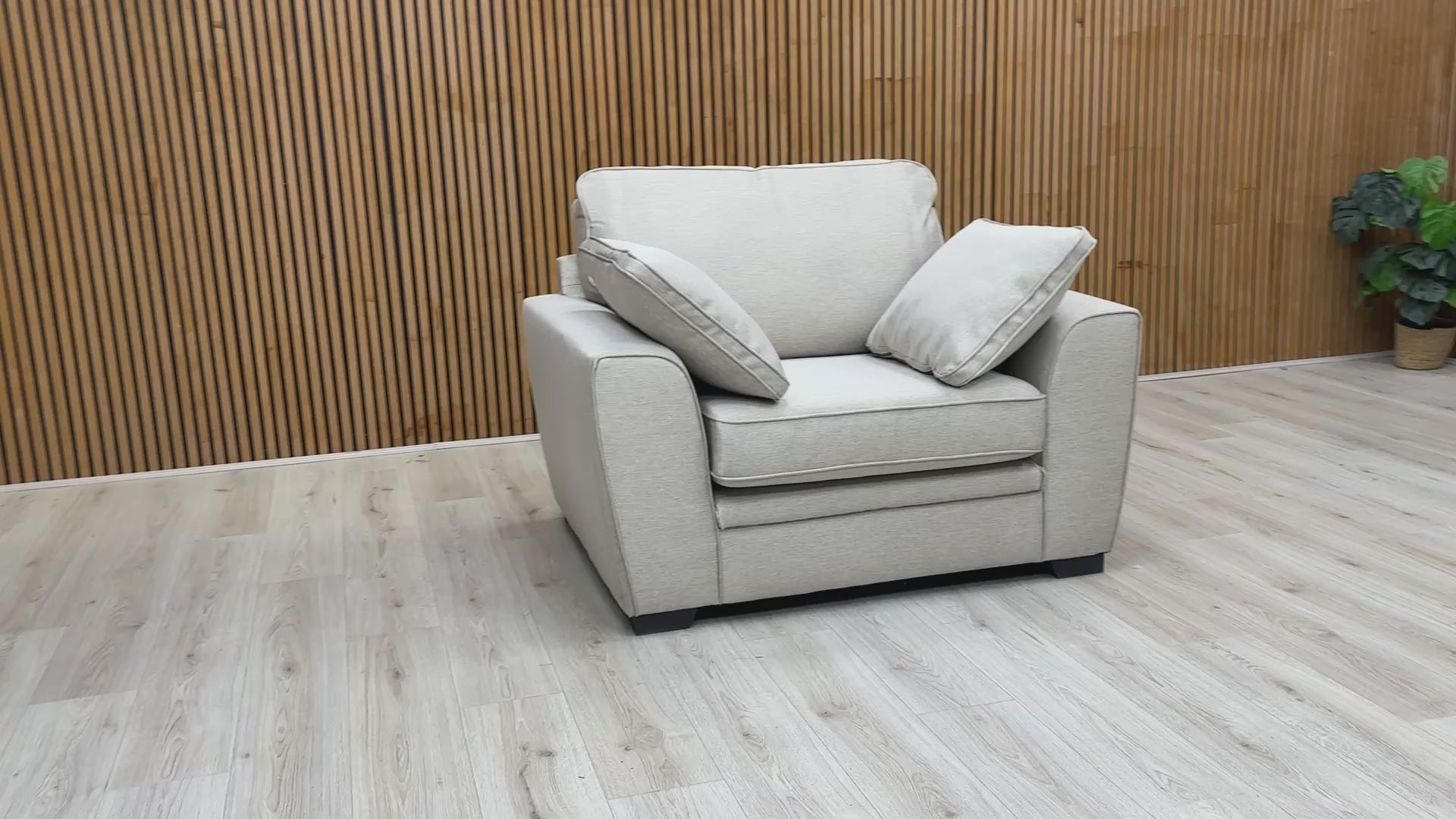 video showcasing the 'Chalfont' armchair in a modern living room environment.